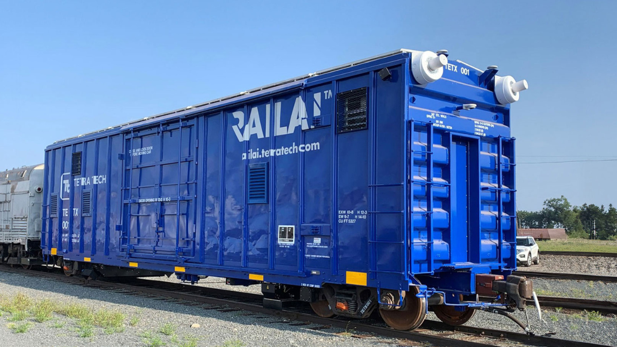 Blue rail inspection car with Tetra Tech branding positioned on track for maintenance operations