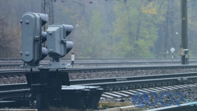 Railway signal and trackside equipment installed alongside active rail tracks