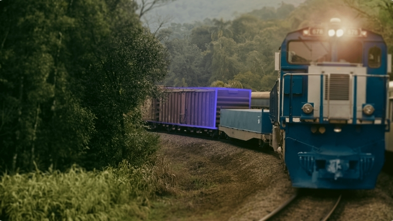 Freight train transporting cargo along curved railway track